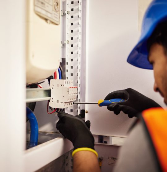 Electrician, screwdriver and repair with man in control room for tools, mechanic and safety. Electricity, energy and power with male technician and check for generator, maintenance and circuit.